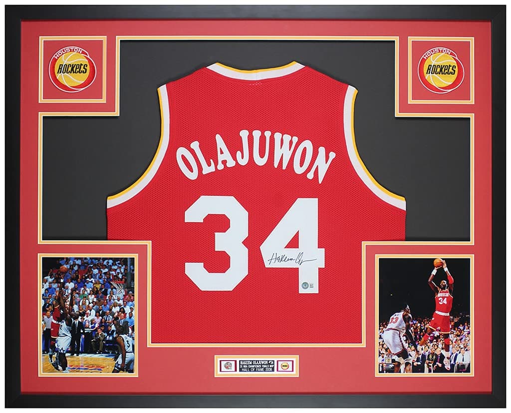 Hakeem Olajuwon Autographed Red Houston Rockets Jersey - Beautifully Matted and Framed - Hand Signed By Hakeem and Certified Authentic by Beckett -...